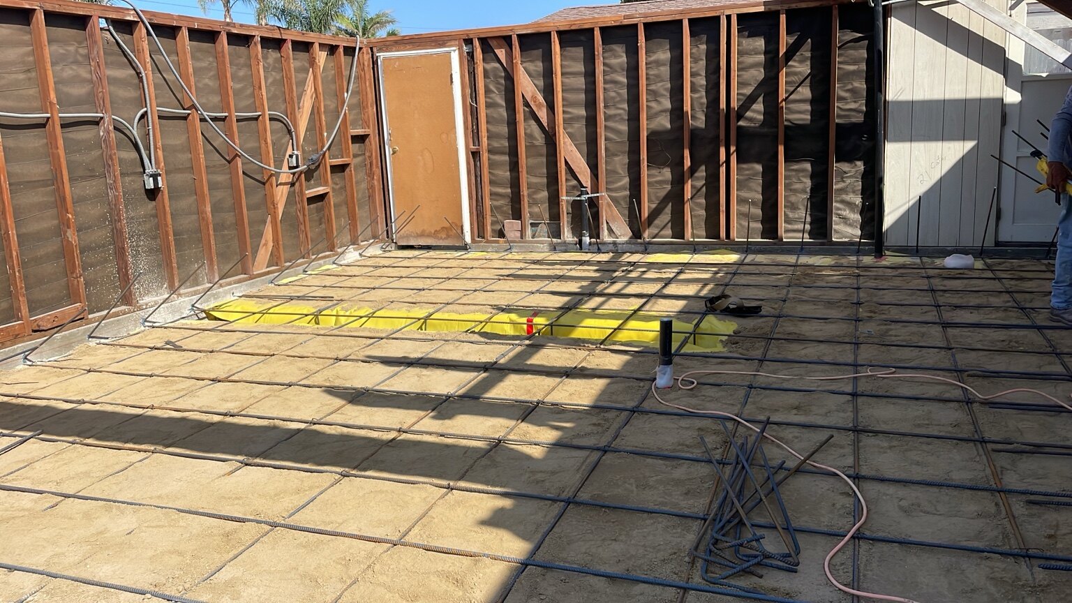 Reinforcing steel and utility preparation for a garage conversion ADU