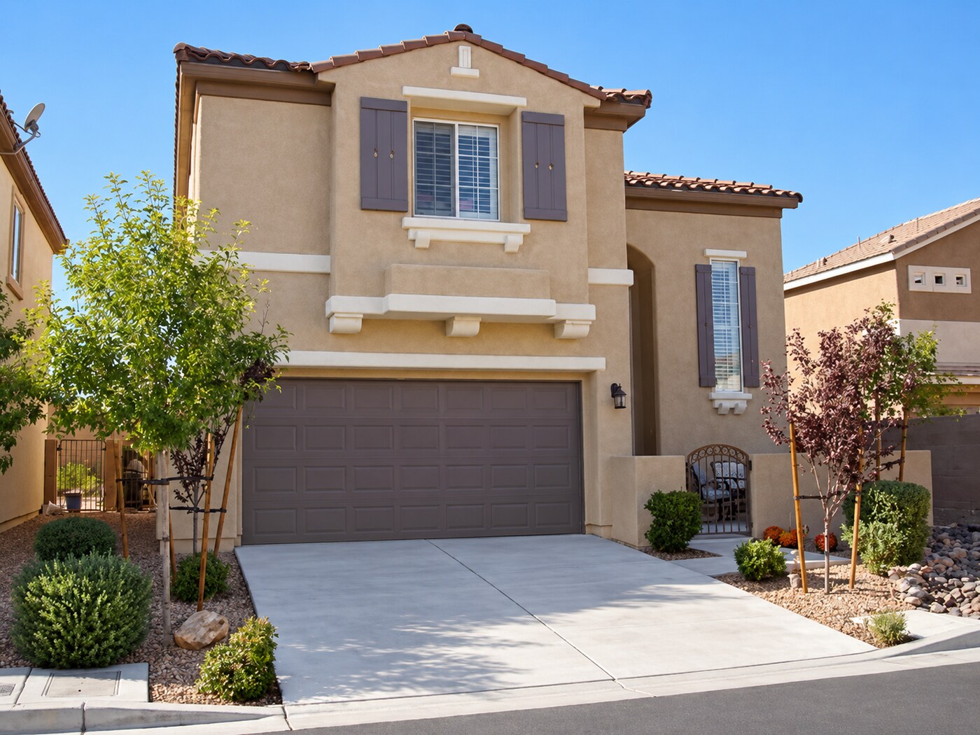 Completed two-story home with landscaped front yard