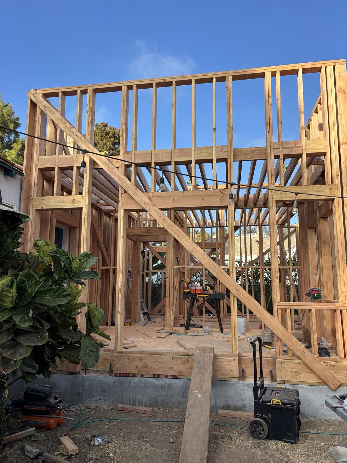 Wide view of residential wood framing in progress